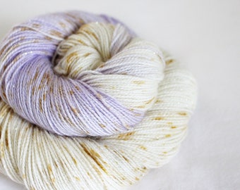 Navi - Magpie - 75/20/5 superwash merino/ nylon/ gold stellina sock yarn