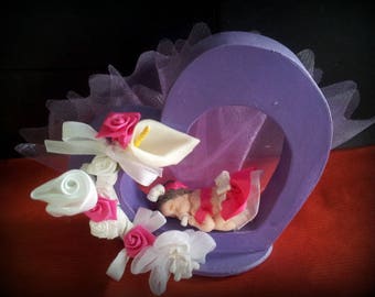 wooden heart decorated with baby