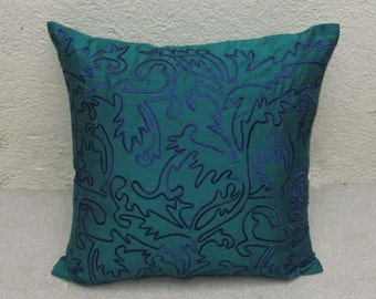 teal green throw pillow cover with blue Moroccan inspired embroidery
