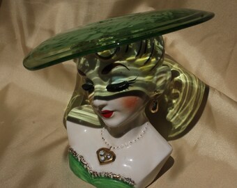 Antique woman figurine with glass