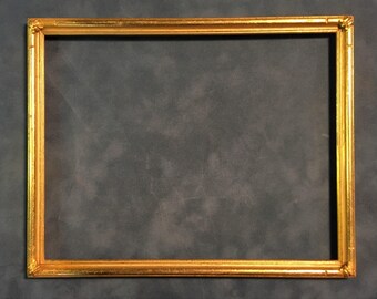Antique gilded hand carved wood frame, rectangular with corner ornaments