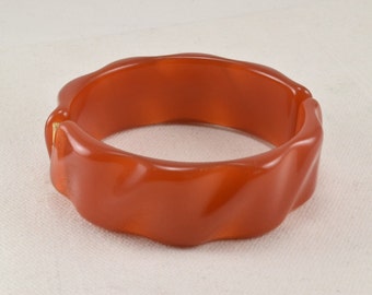 Orange lucite clamper bracelet, carved lucite bangle, 1960s vintage chunky bracelet, translucent amber bangle