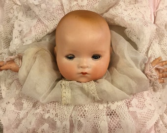 Sweetest Antique German bisque puppet baby in pillow/Pillow puppet