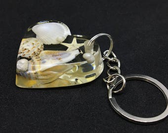 Key pendant with starfish, clams and small beads