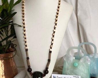 Ceramic focal with wood and glass beads