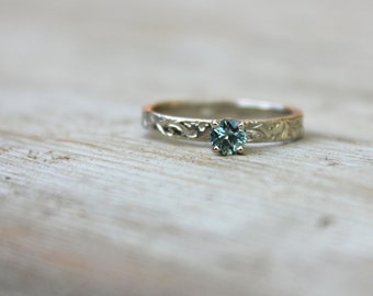 ethical fair trade sea foam Montana sapphire engagement ring . recycled 14k white gold vine band . prong setting . made to order