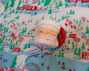 miniature santa mug with with closed eyes