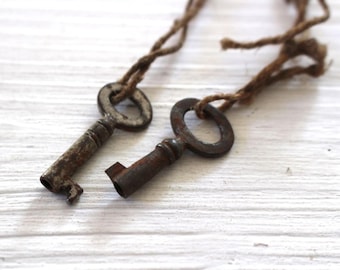 Pair of tiny vintage rusty keys