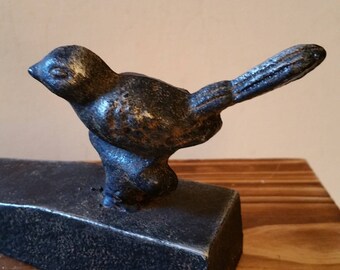 Cast iron door stop or paperweight with bird