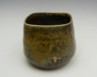 Wood fired cup with ash glaze