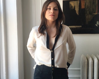 White button down blouse with gold buttons