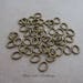 100 antique gold plated brass open split oval jumprings 18 gauge 6mm x 4mm