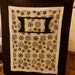 Black and White Wheelchair Quilt featuring a Hand Warmer and Pocket