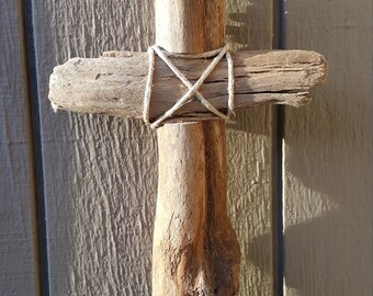11.5" x 8" driftwood cross with hemp accents.