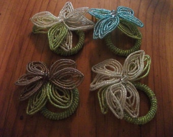 4 BEADED NAPKIN RINGS, beaded flower, glass beads