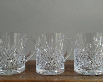Set of three decorative glass mugs