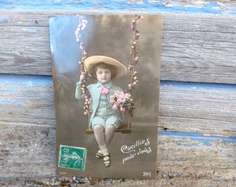 Vintage Antique 1900/1910 French real recolored photography postcard boy on a balançoire
