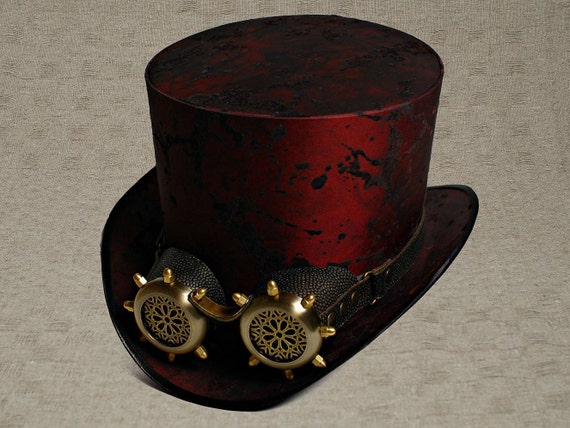 Well done handcrafted steam punk top hat with goggles, crafted in SteamPunkHatMaker workshop. Well done handcrafted steam punk top hat with goggles, crafted in SteamPunkHatMaker workshop.