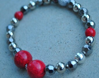 Handmade bracelet,red and silver beads with a white/silver accent one
