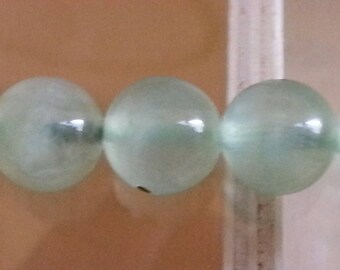 1 Pearl, prehnite 8mm in diameter, hole 1 mm