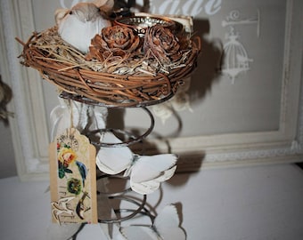 Candle in a rustic nest on spring