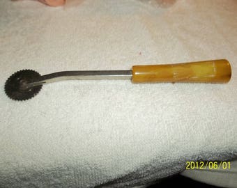 vintage tracing whrrl with celluloid handle