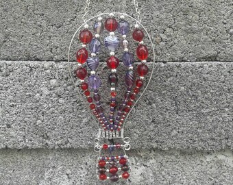 Hot air balloon wall hanging / window hanging . For indoors only .