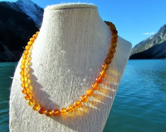 vintage round baltic amber bead necklace with silver clasp.