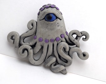 Ocho the octo brooch by Marie Segal 2008 from a series of EyeDollz