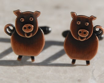 Pig cufflinks in copper finish