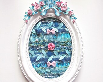Textile art, Textile painting, shabby chic weaving in an oval white frame with a blue and pink baroque decoration