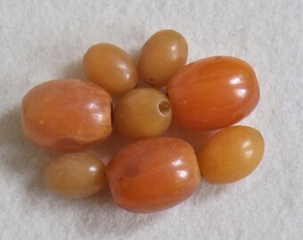 8 Interesting African Copal 'Amber' Beads found in a box of French Bobbins. Yellow Beads. Trading Beads. Beautiful big beads.