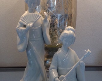 Two blanc de chine style geisha statues