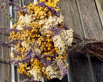 Dried flowers. Wildflower bouquet, yellow, white, purple. Tansy, Yarrow. Floral arrangement, centerpiece.