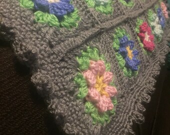 Crocheted colorful flower baby blanket