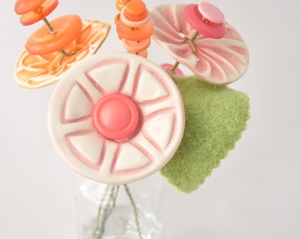 pink and orange button flower bottle bouquet