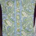 Blue, Greens,Yellow, on Off-White Background with Scroll/Paisley Print Reversible Dickie Bib Ratcatcher