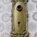 Stunning antique heavy brass escutcheon key hole door plate in bronze