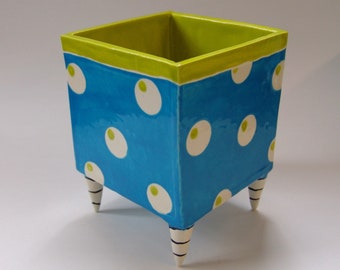 whimsical pottery Planter, bright blue with gum ball polka-dots, Black & White striped Beetlejuice legs
