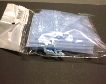 Ten blue pouches that closes with a satin ribbon
