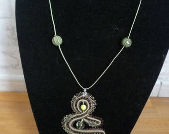 Lace pendant with spindles, glass bead, ceramic bead