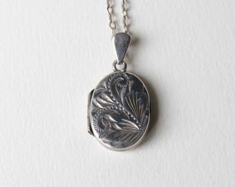 Vintage Sterling Silver floral engraved oval locket pendant. 925 sterling silver engraved oval locket for two pictures. 1980's silver locket