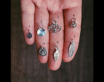 Add a silver charm to your mala