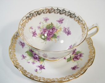 Collingwoods Tea Cup and Saucer, White and Gold teacup with Violets.