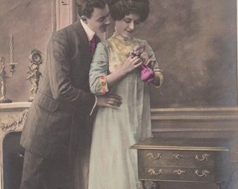 Romantic vintage French lovers postcard . Couple Love card .