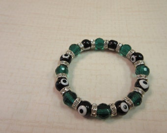 Black and emerald green evil eye beaded bracelet