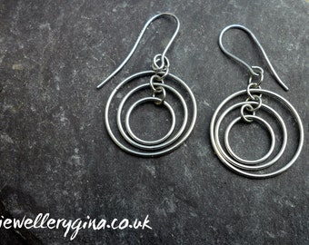 Sterling silver triple ring earrings. Silver earrings made with three matching rings.