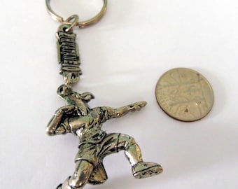 Vintage silver tone Thunderbird Totem key chain, souvenir key chain. Marked: ZIHUATANCIO XTAPA. 3 1/4", very good, used, vintage condition