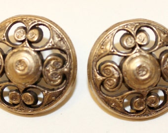 2 Vintage gold metal buttons with cut metal swirl design.