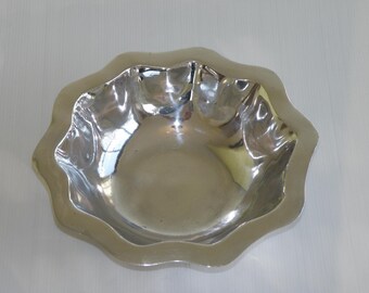Wavy rim cast and polished aluminum fruit bowl